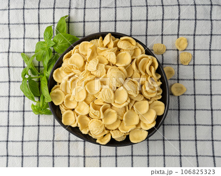 Raw Orecchiette Pasta, Homemade Dry Macaroni, Italian Recchietedde Raw Orecchiette Pasta, Homemade Dry Macaroni, Italian Recchietedde 106825323