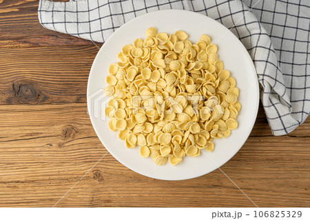 Raw Orecchiette Pasta, Homemade Dry Macaroni, Italian Recchietedde Raw Orecchiette Pasta, Homemade Dry Macaroni, Italian Recchietedde 106825329