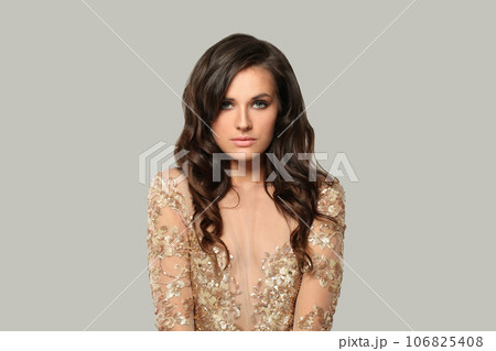 Nice good-looking brunette woman fashion model with makeup and wavy hair 106825408