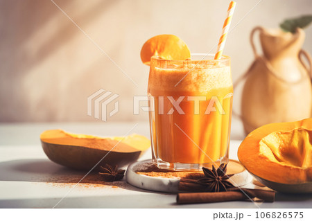 Autumn pumpkin spicy latte with whipped cream and cinnamon, Seasonal warming drink, light background 106826575