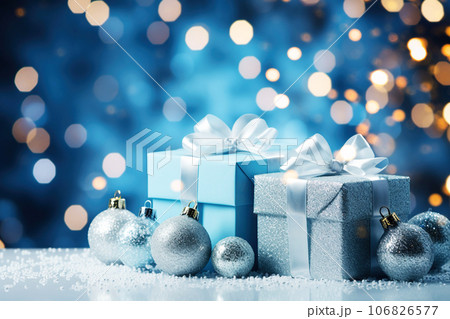 Christmas gifts and blue toy balls on a shiny blue holiday background, copy space. Winter holidays card 106826577