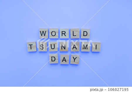 November 5, World Tsunami Awareness Day, minimalistic banner with the inscription in wooden letters November 5, World Tsunami Awareness Day, minimalistic banner with the inscription in wooden letters 106827195