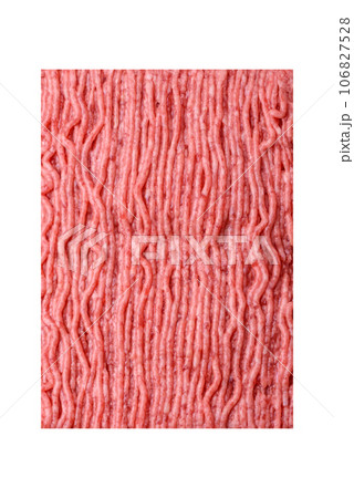 Raw beef or pork mince with salt spices and herbs on a wooden cutting board Raw beef or pork mince with salt spices and herbs on a wooden cutting board 106827528