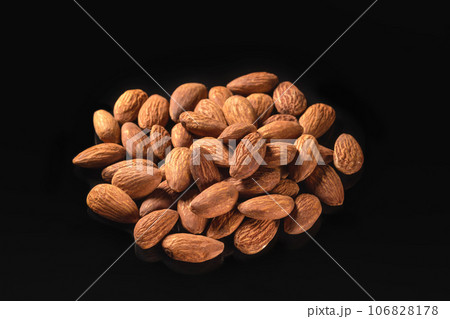 Almond isolated on black background closeup. Healthy food 106828178