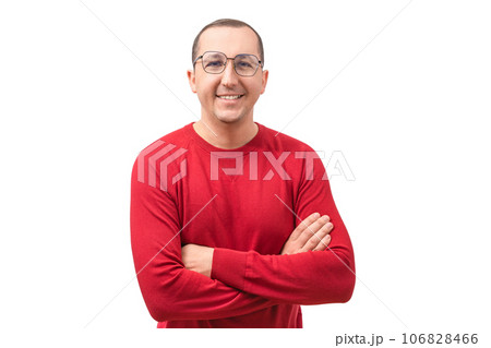 Portrait of a happy young man looking at the camera on a white background. Success concept Portrait of a happy young man looking at the camera on a white background. Success concept 106828466