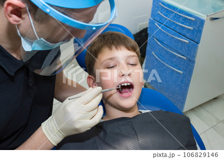 A young patient at the dentists. Medicine, dentistry and healthcare 106829146