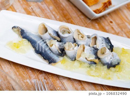 Herring fillet with onion and sunflower oil Herring fillet with onion and sunflower oil 106832490