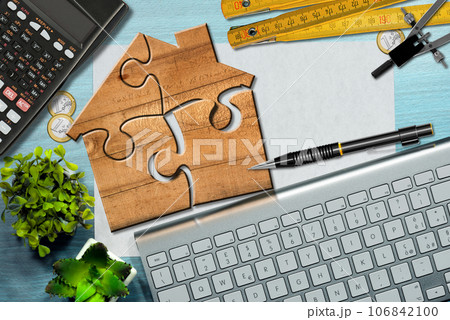 Wooden Jigsaw Puzzle Pieces Forming a House Shape 106842100