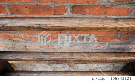 abstract rough dark background made of mixed materials, combination of wood, brick and stone in the texture of a facade fragment, exterior details made of different materials abstract rough dark background made of mixed materials, combination of wood, brick and stone in the texture of a facade fragment, exterior details made of different materials 106843121