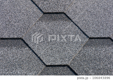 Shingles texture - close up view of asphalt roofing shingles Shingles texture - close up view of asphalt roofing shingles 106843896