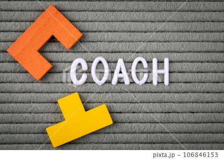 COACH Concept. White letters of the alphabet on a green background 106846153