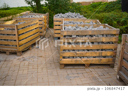 the remaining pieces of paving slabs on a wooden pallet after the completion of works on the improvement of the city 106847417