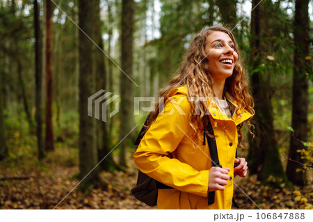 Happy woman enjoying green beautiful nature woods forest. Concept of healthy natural lifestyle. 106847888