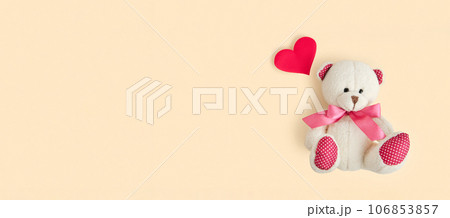 Valentine's Day. Love heart. Teddy Bear and Red Heart on Neutral Beige Color Pastel Background. Vintage Retro Romantic Style. Unusual Creative Greeting Card. Family, Wedding and Friendship. Top View Valentine's Day. Love heart. Teddy Bear and Red Heart on Neutral Beige Color Pastel Background. Vintage Retro Romantic Style. Unusual Creative Greeting Card. Family, Wedding and Friendship. Top View 106853857