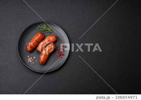 Delicious grilled chicken or pork sausages with salt, spices and herbs 106854971