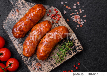 Delicious grilled chicken or pork sausages with salt, spices and herbs 106854980