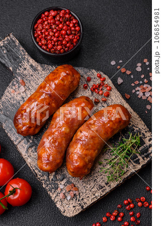Delicious grilled chicken or pork sausages with salt, spices and herbs Delicious grilled chicken or pork sausages with salt, spices and herbs 106854981