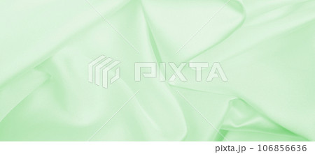 Smooth elegant green silk or satin luxury cloth texture as abstract background. Luxurious background design Smooth elegant green silk or satin luxury cloth texture as abstract background. Luxurious background design 106856636