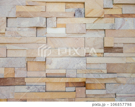 The cladding stone wall is decorated on the building pole. 106857798