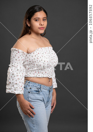 Portrait of young plus size hispanic model 106857892