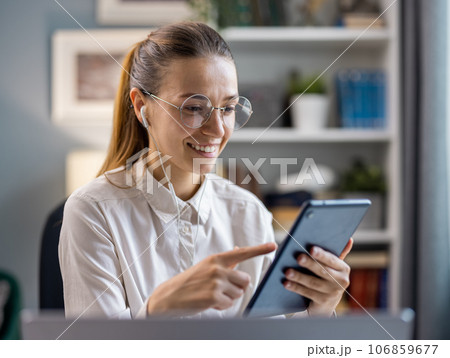 Young woman using tablet 106859677