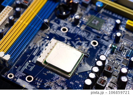 Motherboard close-up with contacts, desktop PC. Computer technology hardware components background Motherboard close-up with contacts, desktop PC. Computer technology hardware components background 106859721