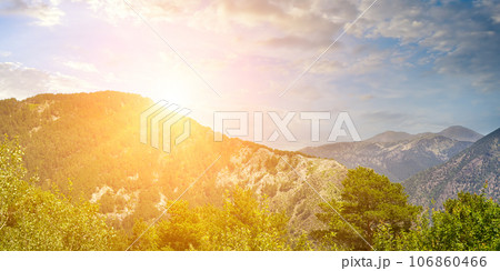 Picturesque mountain slopes with forests and sunrise. Andorra . Wide photo. 106860466