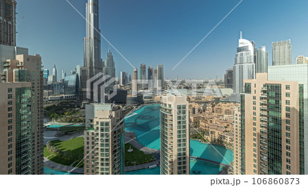 Panorama showing Dubai Downtown cityscape with tallest skyscrapers around aerial timelapse. Panorama showing Dubai Downtown cityscape with tallest skyscrapers around aerial timelapse. 106860873