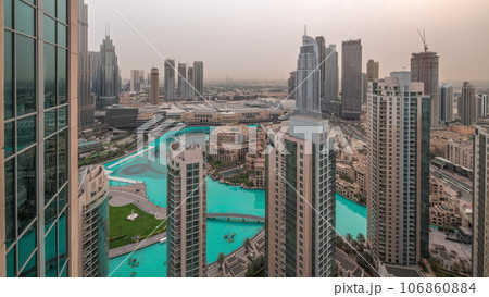 Dubai downtown with fountains and modern futuristic architecture aerial night to day timelapse Dubai downtown with fountains and modern futuristic architecture aerial night to day timelapse 106860884