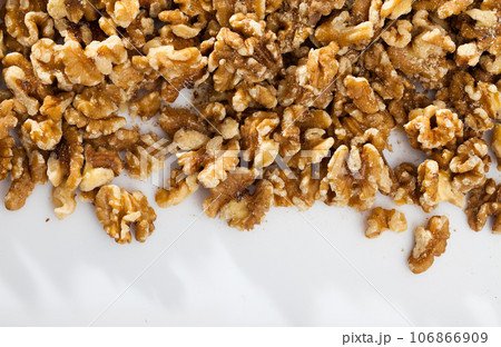 Shelled walnuts on white background 106866909