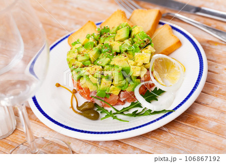 Salmon tartar with avocado Salmon tartar with avocado 106867192