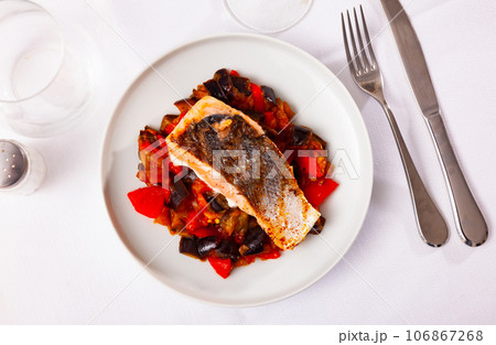 Baked salmon fillet with mix of vegetables Baked salmon fillet with mix of vegetables 106867268