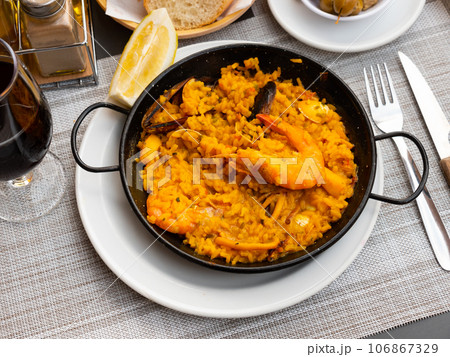 Just cooked paella de marisco on table 106867329