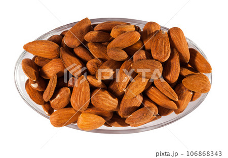 Image of roasted salt almonds on glass bowl, nobody 106868343