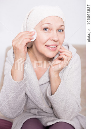 Woman cleaning face Woman cleaning face 106868687