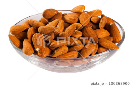 Image of roasted salt almonds on glass bowl, nobody 106868900