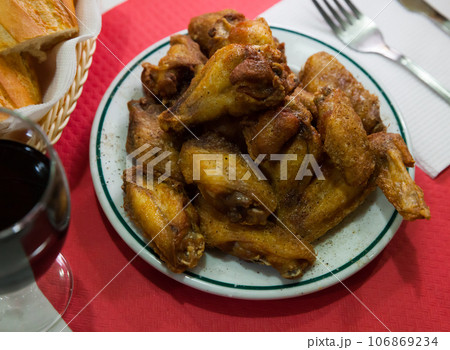 Chicken wings with golden crust 106869234
