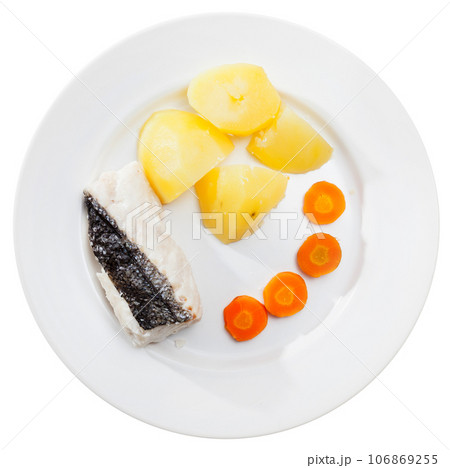 Pollock prepared on steam, served with boiled potatoes and carrots 106869255