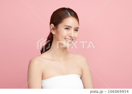 Beautiful young asian woman with clean fresh skin on pink background, Face care, Facial treatment, Cosmetology, beauty and spa, Asian women portrait. Beautiful young asian woman with clean fresh skin on pink background, Face care, Facial treatment, Cosmetology, beauty and spa, Asian women portrait. 106869954
