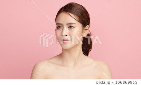 Beautiful young asian woman with clean fresh skin on pink background, Face care, Facial treatment, Cosmetology, beauty and spa, Asian women portrait. Beautiful young asian woman with clean fresh skin on pink background, Face care, Facial treatment, Cosmetology, beauty and spa, Asian women portrait. 106869955