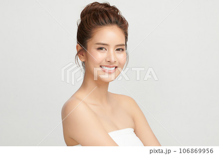 Beautiful smile of young woman with healthy white teeth on beige background, Dental care. Dentistry concept. Beautiful smile of young woman with healthy white teeth on beige background, Dental care. Dentistry concept. 106869956
