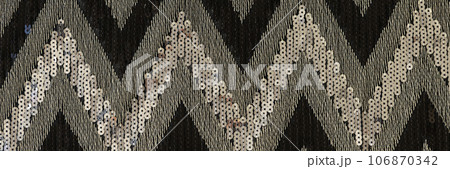 Multicolor fabric with zigzag pattern as background. 106870342