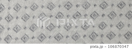 Gray and white fabric with geometric ornament. Gray and white fabric with geometric ornament. 106870347