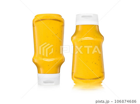Bottle of classic hot dog and fries mustard sauce on white background. Bottle of classic hot dog and fries mustard sauce on white background. 106874686