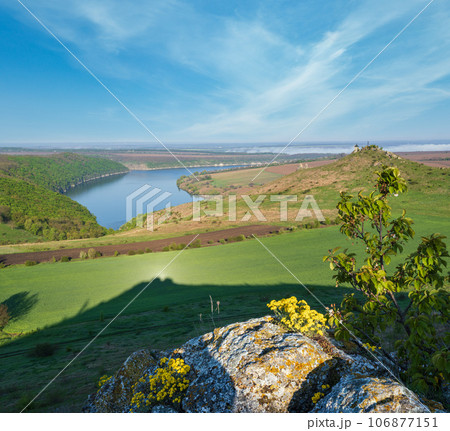 Amazing spring view on the Dnister River Canyon with picturesque rocks, fields, flowers. This place named Shyshkovi Gorby,  Nahoriany, Chernivtsi region, Ukraine. 106877151