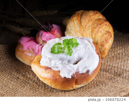 Various types of bread on wooden 106878224