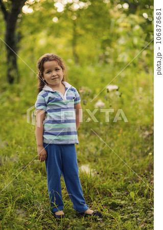 little girl in the garden 106878681