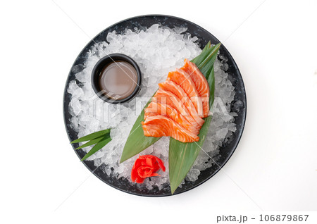 Salmon sashimi plate with sauce on ice 106879867