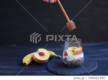 Healthy breakfast with chia seeds, yogurt, fruit and honey 106882906