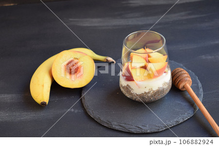 Healthy breakfast with chia seeds, yogurt, fruit and honey 106882924